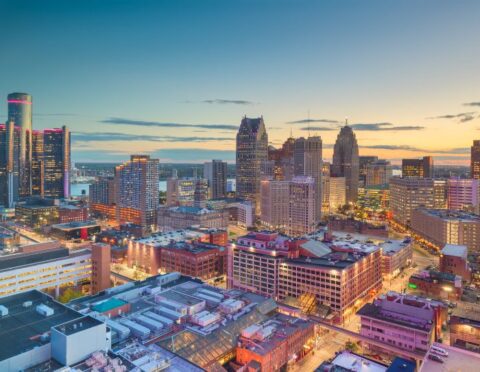 Detroit, Michigan, USA downtown skyline from above at dusk.