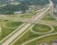 High-angle aerial view of a cloverleaf highway interchange in Lansing, Michigan